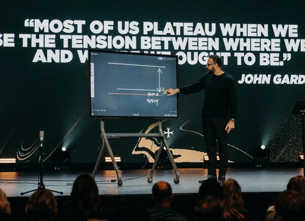 Joshua Craft speaking on stage